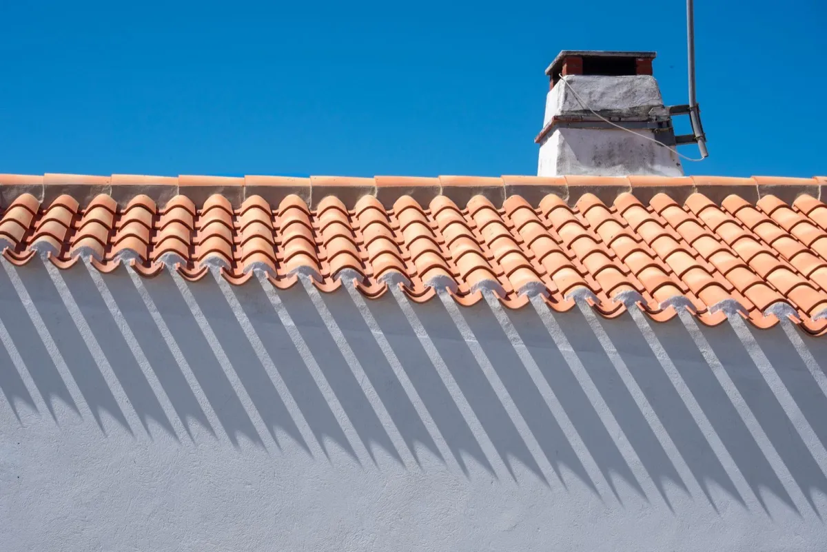 Roof ridge line and chimney on a home in Fontana, CA